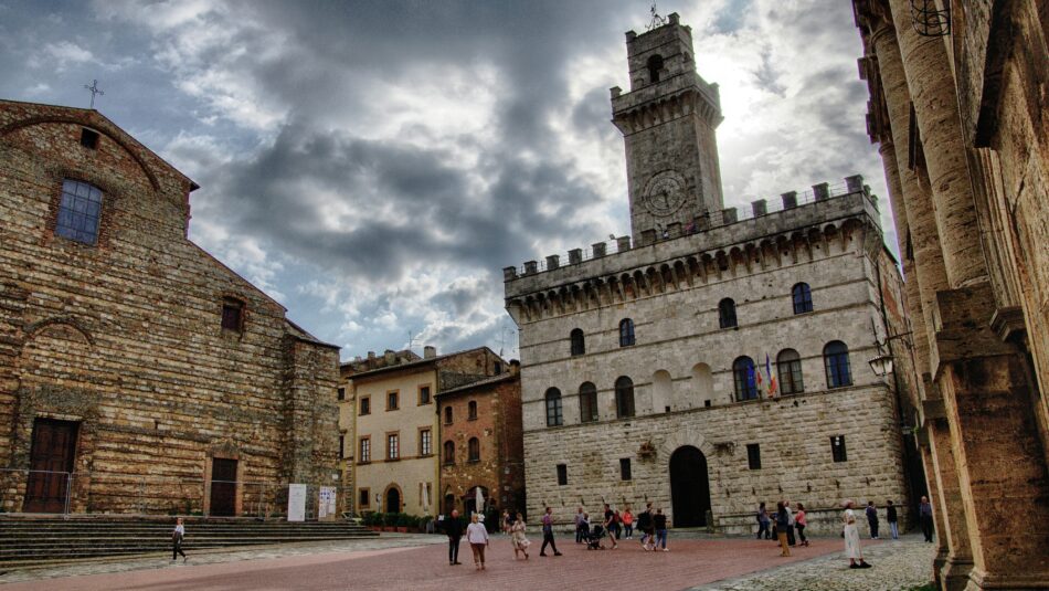 medieval square and clock tower of Montepulciano in Italy