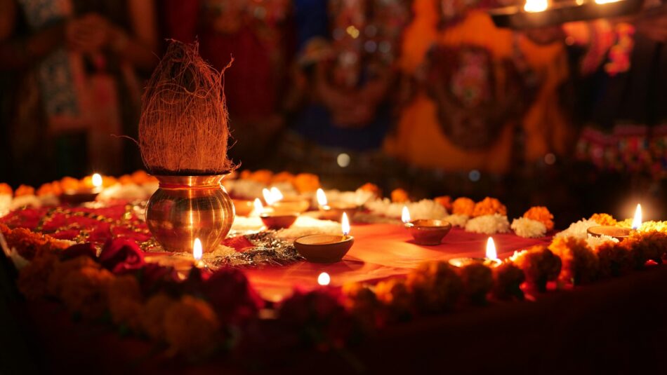 Multiple diyas lighted during the aarti celebration for the event of Navratri, Garba, and Diwali