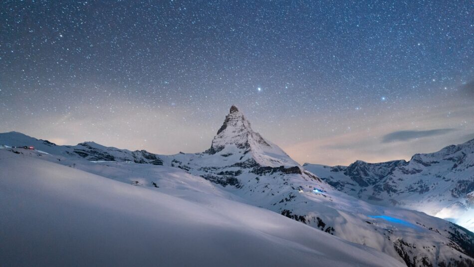 view of the Matterhorn in Switzerland with snow and stars
