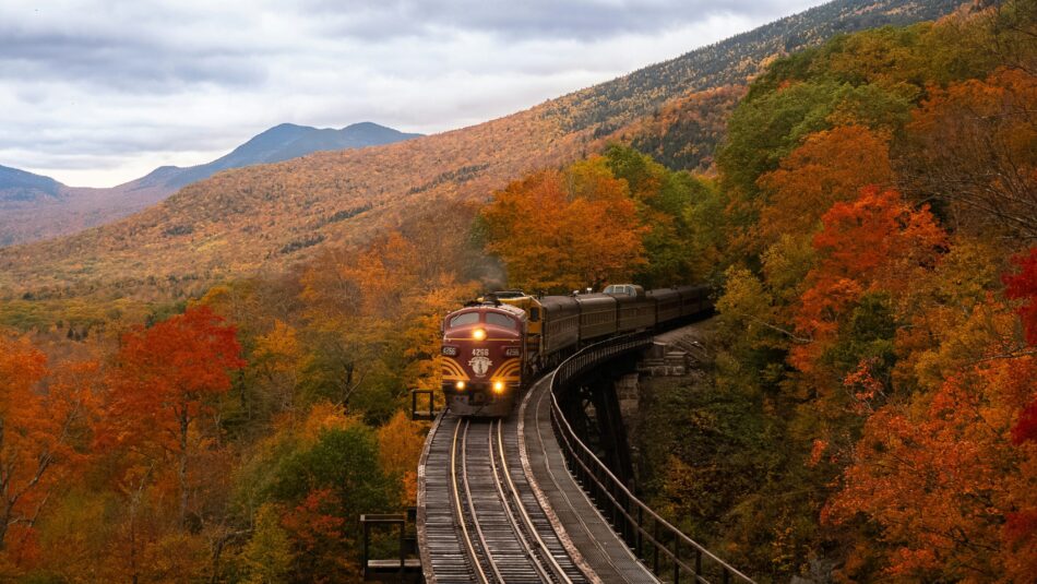 train passing through autumnal scenery in New Hampshire