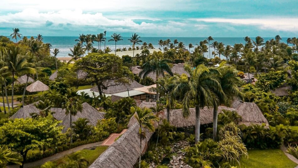 paradise-like views of houses by the beach in Fiji