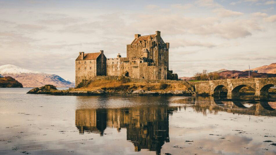 Eilean Donan Castle in Scotland with a bridge over a lake