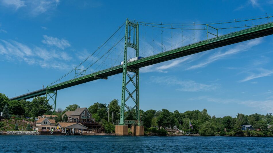 blue sky views of Kingston–Port Ewen Suspension Bridge in New York