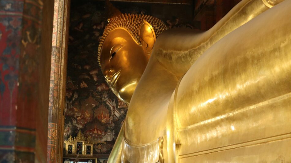 the golden reclining buddha of Wat Pho temple in Thailand