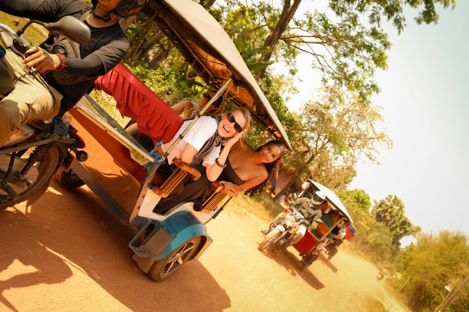 Contiki ride cambodia trip: travellers on tuk tuk